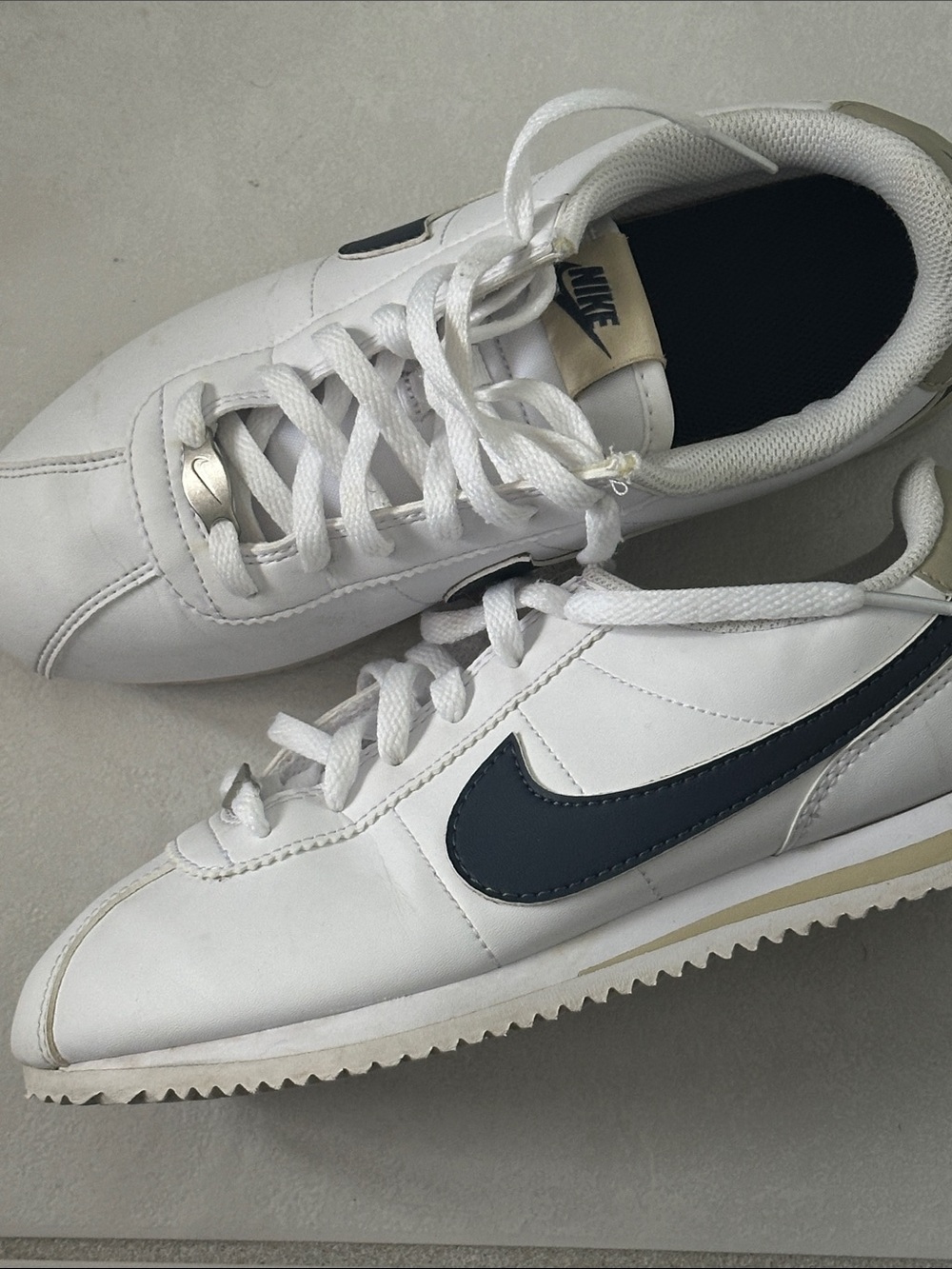 Nike Kids Cortez White Sneakers with Navy Swoosh and tan accents